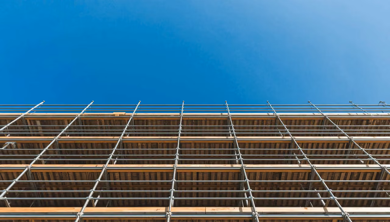 Scaffolding against a blue sky on a construction site